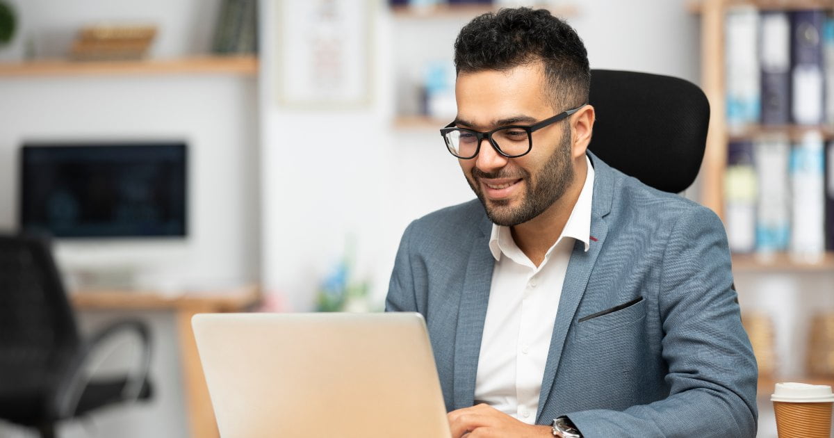 professional doing work on laptop