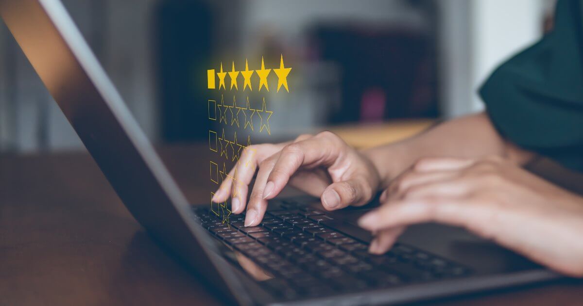 leaving an online review using a laptop