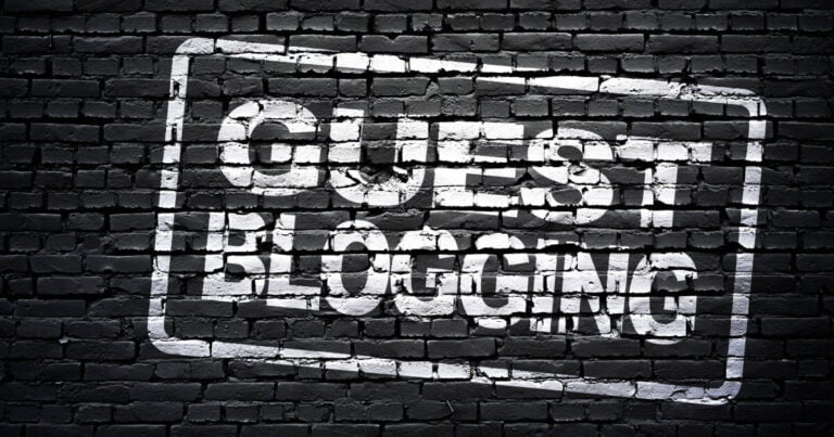 guest blogging written on black brick wall
