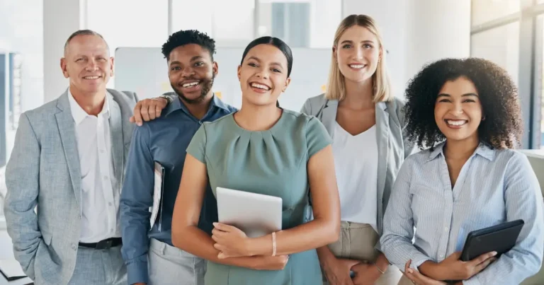 group portrait of five individuals in an office